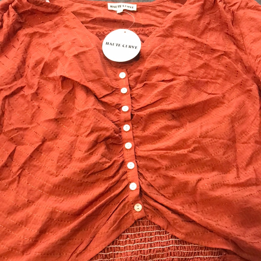 Crop top size :3xl runs small fits a 2x